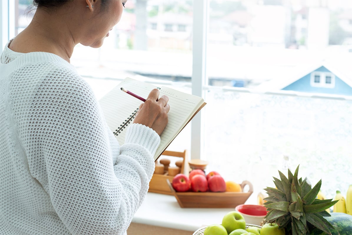 Woman making a list to help her age well