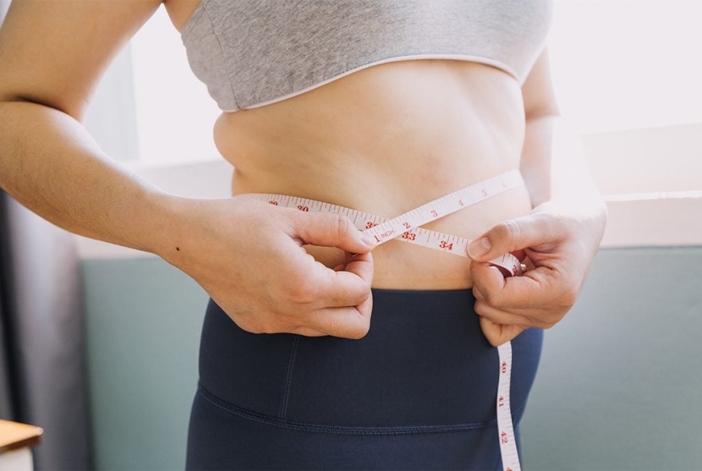 Women measuring belly